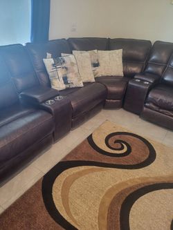 Kanes Leather reclining sectional