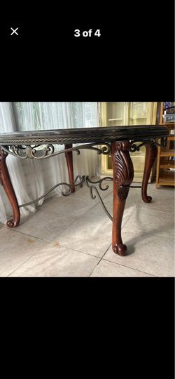 Spanish style stone and wood iron table
