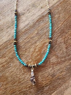 Turquoise Gold Banded Cinerea Shell Necklace