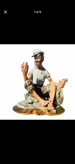 D. Bonalberti Capodimonte porcelain sailor figurine holding a net