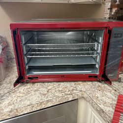 Red And Stainless Steel Oster Oven And Air Fryer 