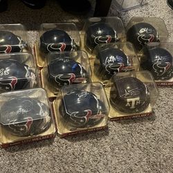 Texans And a Aggies football helmet