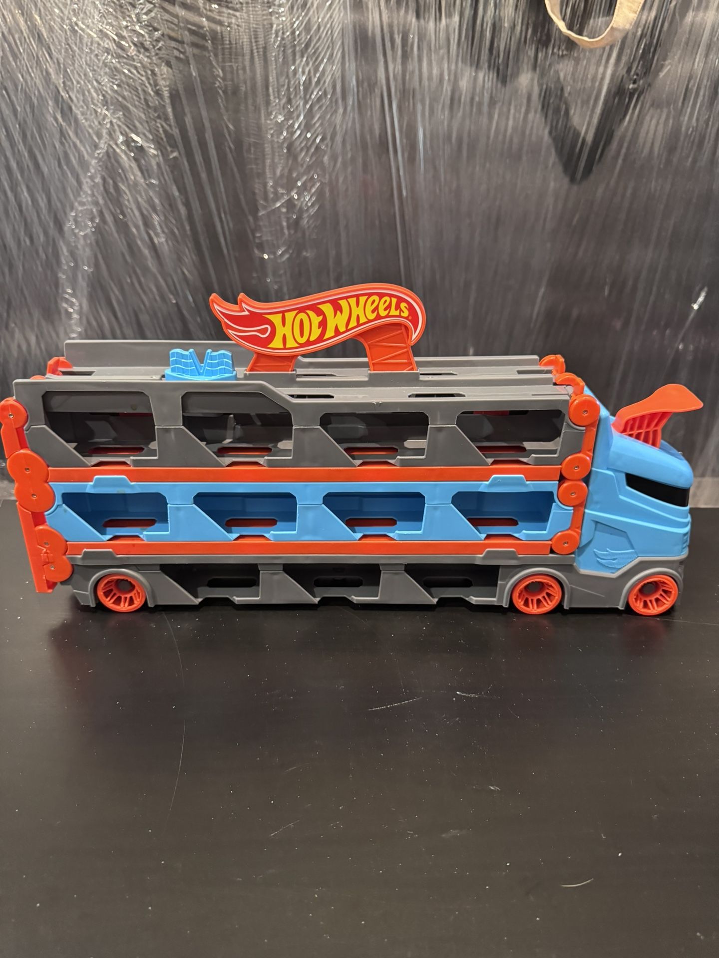 Hot Wheels Mega Hauler Truck – 6-Level Car Carrier, Storage Transporter (Blue/Red) 
