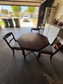 Carved wood table and chairs
