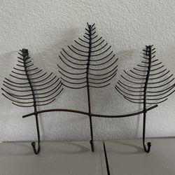 Decorative metal wall rack