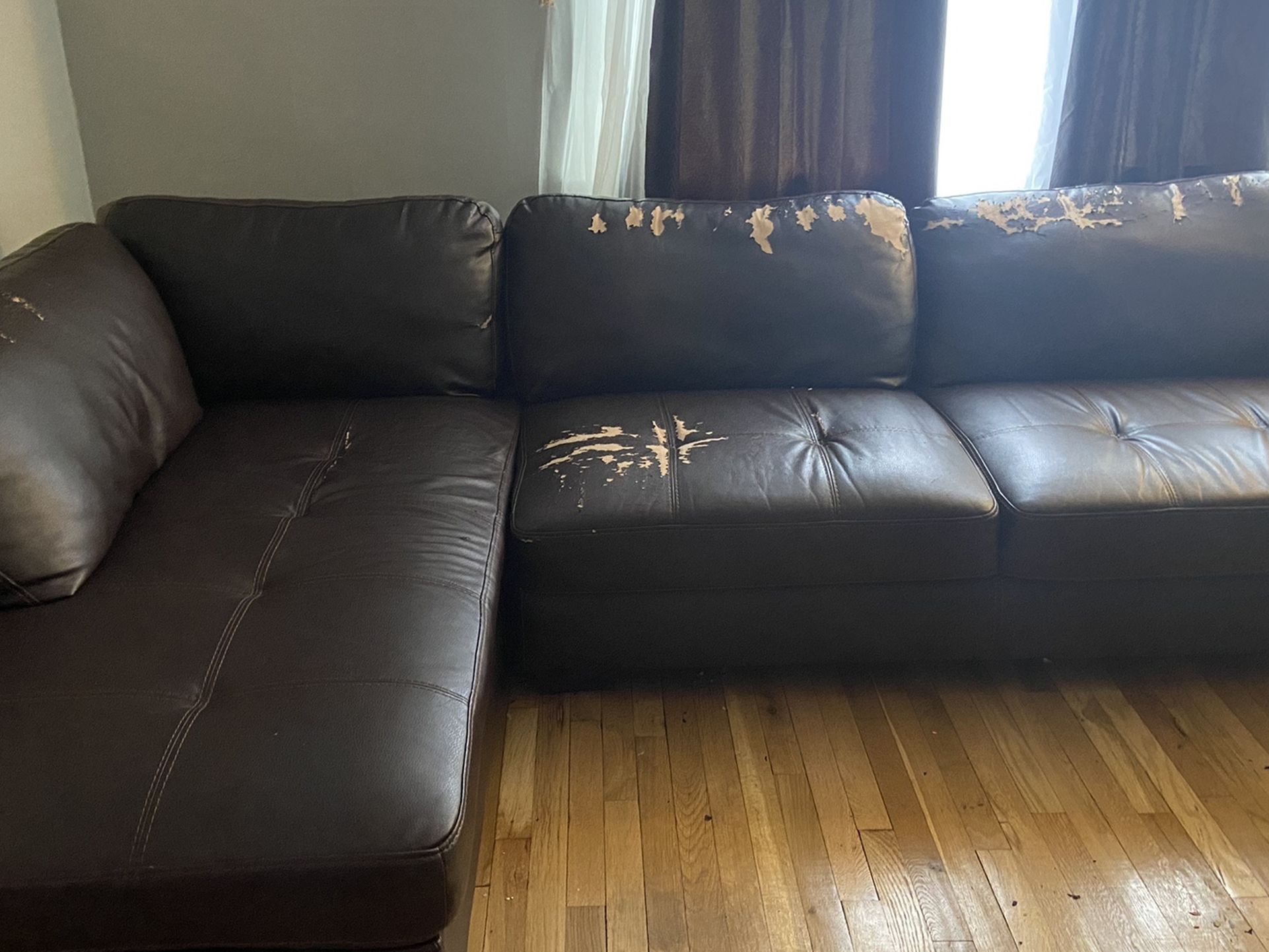 Brown Leather Sectional and Ottoman