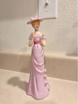 Enesco 9” tall woman in pink with hat