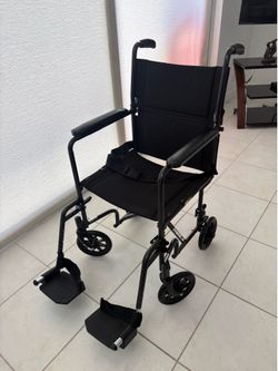 Drive foldable transport wheelchair