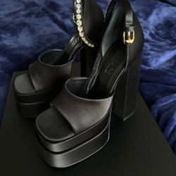 Versace Medusa Aevitas platform sandals in black satin with crystal-embellished ankle straps. 