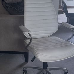 White office chair, with wheels and it spins