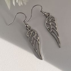 Silver winged earrings.