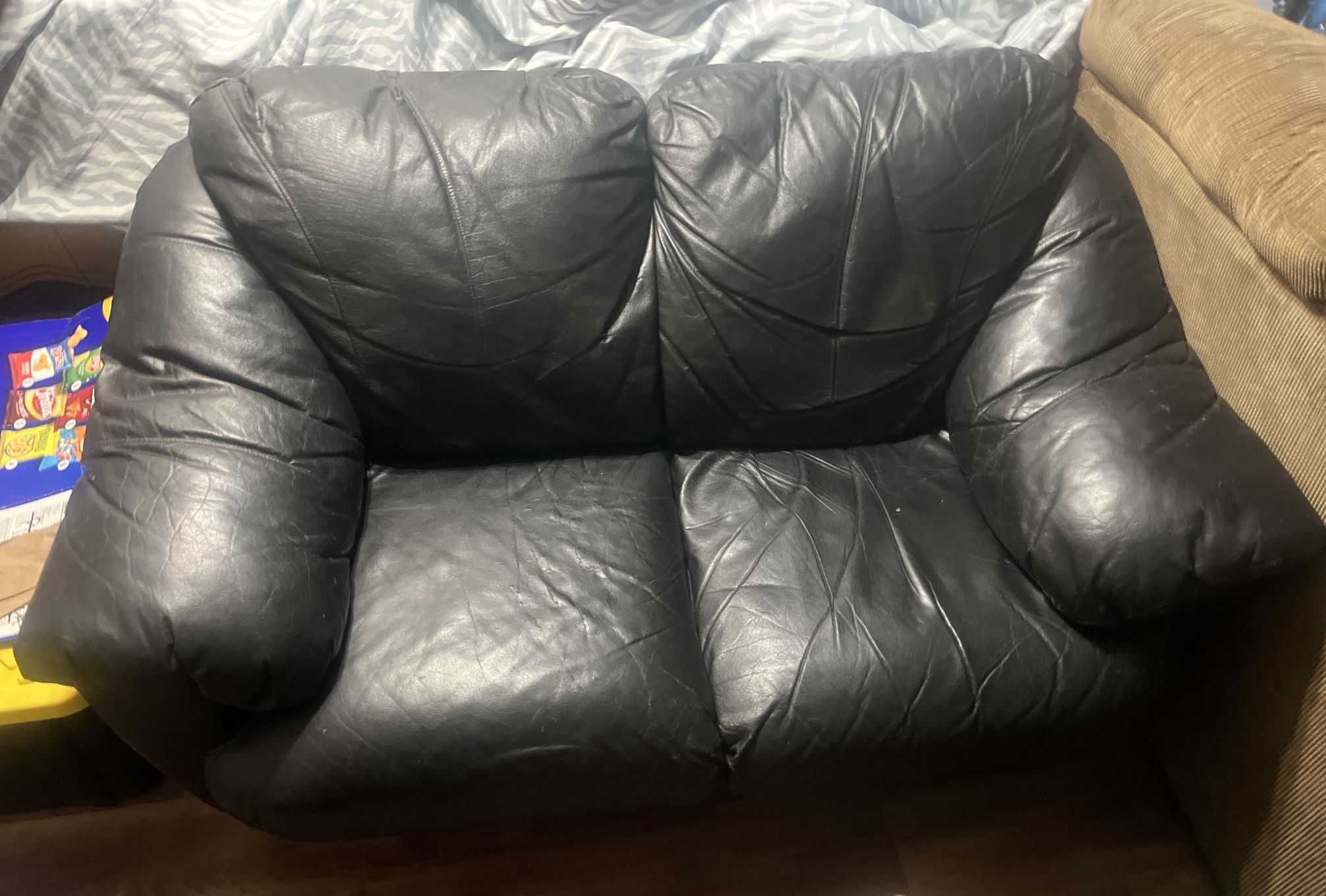 Black leather loveseat