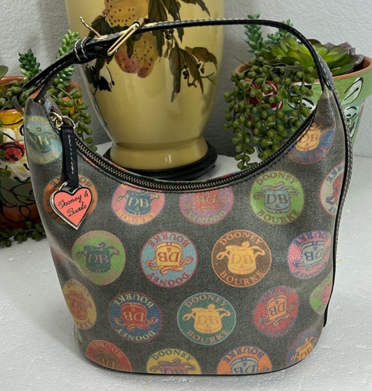 DOONEY & BOURKE MEDALLION HOBO BLACK BUCKET BAG