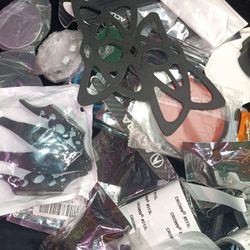 Assorted car accessories for rap ford , dodge , jeep cadillac and others includes decals , other miscellaneous parts