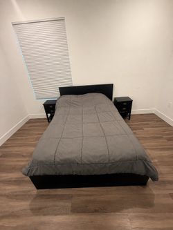 Black full size bed with 2 night stands
