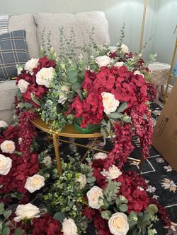 Selling 8 beautiful Burgundy Flower centerpieces: edge of tall style, hanging greenery.