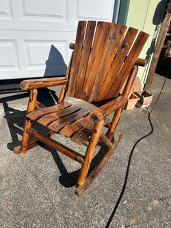 Log cabin style rocking chair in good condition. Very solidly built.  Made by Leigh Country mfg. About $200 new. Use it as is or refinish it if you wa