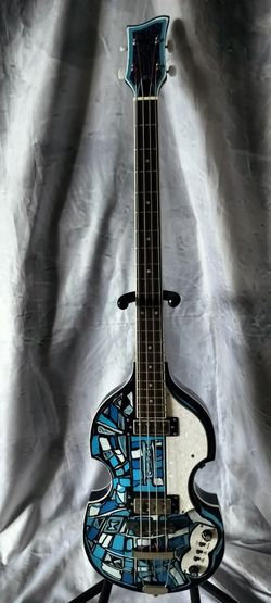 Brand new hollow body electric bass with custom paint design and gig bag