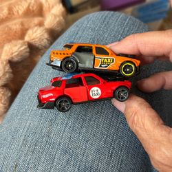 Two Hot Wheels Taxis