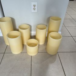 7 Ivory candles light . Battery . Used in good condition. 2 of 14” 4 of 10” and one 6” 