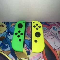 Nintendo Switch Green and Yellow Conttollers