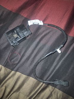 Ford center console USB charging module and wiring harness, bearing part number ML3T-14D202-BA. Item Type: OEM automotive USB media/charging port modu