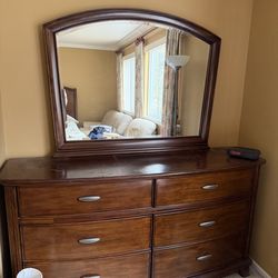 Dark wood dresser with mirror. 6 drawers