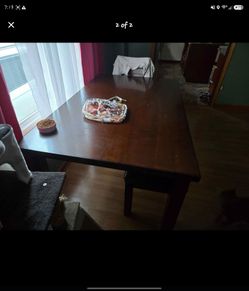 Brown table with bench and one chair