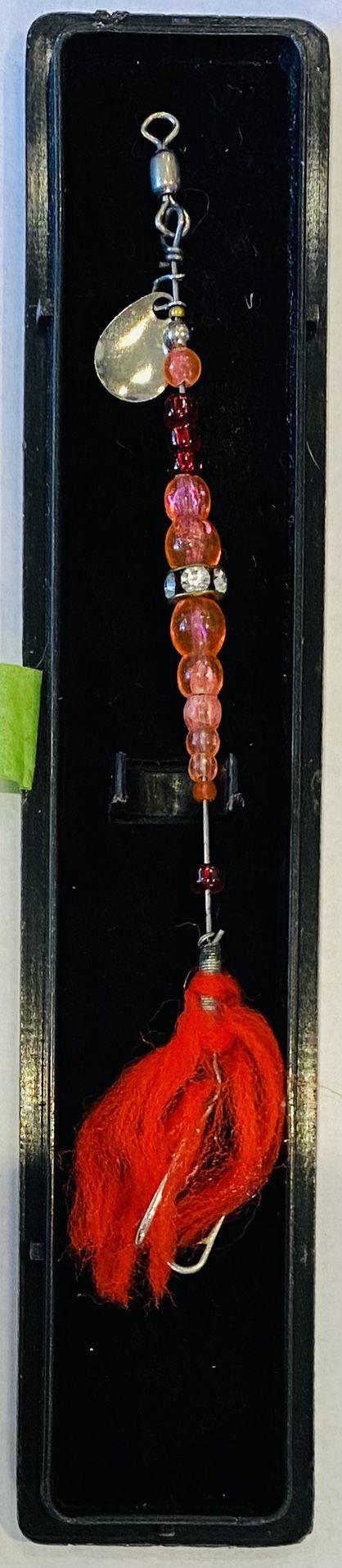 Long Red Fishing Lure in case