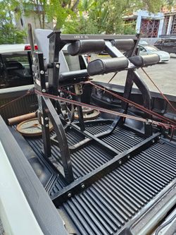 $500 Hammer Strength Plate-Loaded Seated Leg Curl.
Delivery for extra.

Professional-grade gym equipment is a black Hammer Strength plate-loaded seate