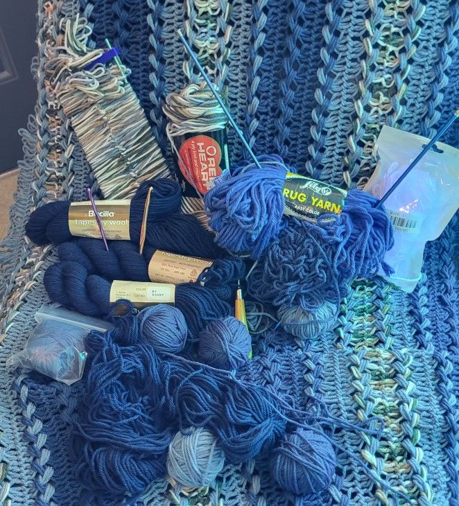 Partially Finished Afghan With Lotsa Yarn And Some Crochet Stick Thingys