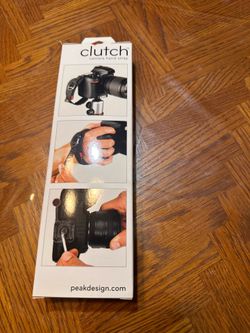 Clutch camera hand grip