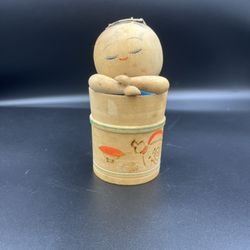 Unique Vintage hand crafted Japanese Kokeshi doll of child in a barrel. Handcarved hand painted.
