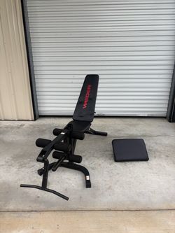 Weider adjustable weight bench with a padded workout seat, backrest, leg curl attachment $100
