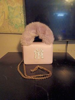 Mini cool purpled color handbag with fur handle