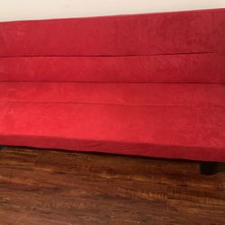Red couch turns into bed for sale 