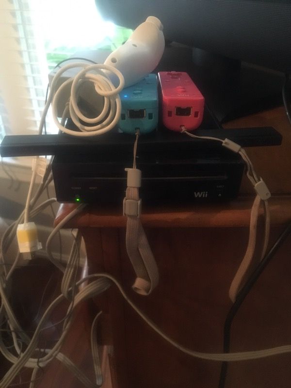 Wii with 3 remotes and 3 games