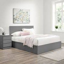 Queen sized bed with mattress, frame, and underbed drawers