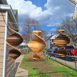 Hand Made Wooden Wind Spinners. 