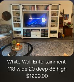 White Wall Entertainment Center We are located at 2811 East Bell road. Another Time Around Furniture.