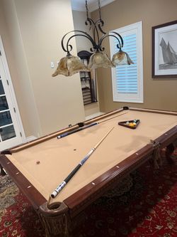 Pool Table with Cues and Ball Rack