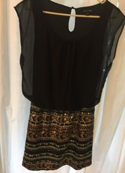 Black top with sequin bottom dress