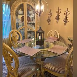 Dinning Room Table With Chairs And A Lit Hutch