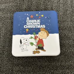 A Charlie Brown Christmas Empty Tin.  Lights Up And Plays Charlie Brown Song