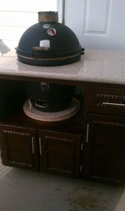 Komado smoker and a stand with granite top