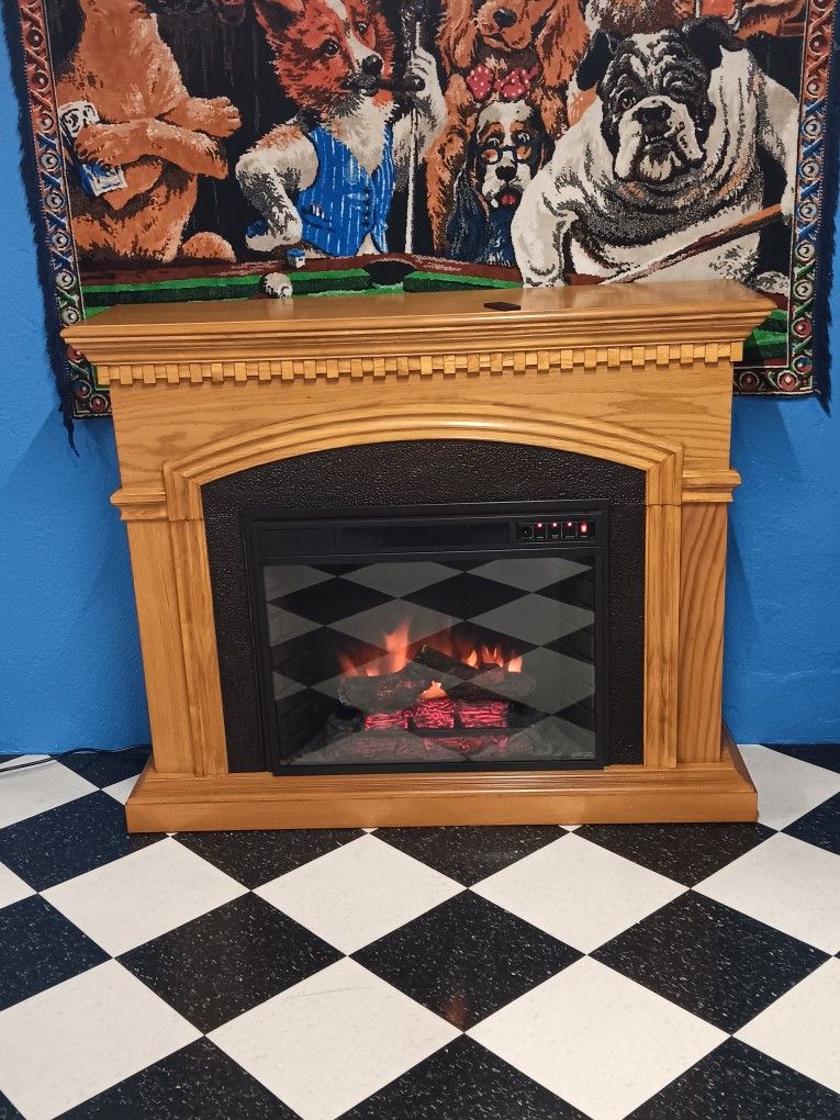 Oak Cabinet Fireplace Electric with remote 53 x 43 x 14 in. Works good. 23 Mile and card Macomb Township Michigan