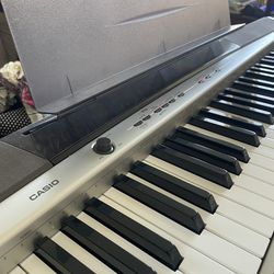 Casio Digital Keyboard Piano with Weighted Keys (Case and Stand Included)