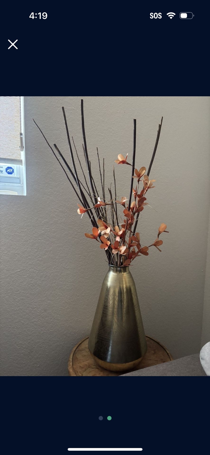 metal vase with flowers 
