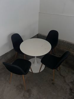 Small round table with four chairs
