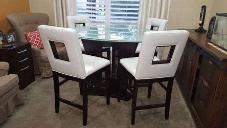 Glass top dining table with for high chairs.